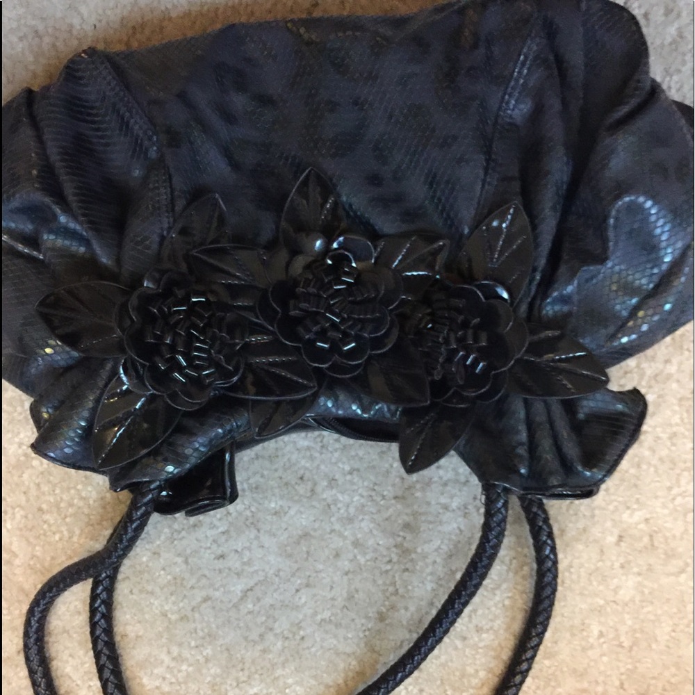 Black purse with flowers